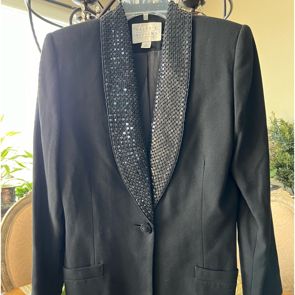 Classy woman’s black blazer screaming 4 some skinny leg jeans/ Louboutin heels